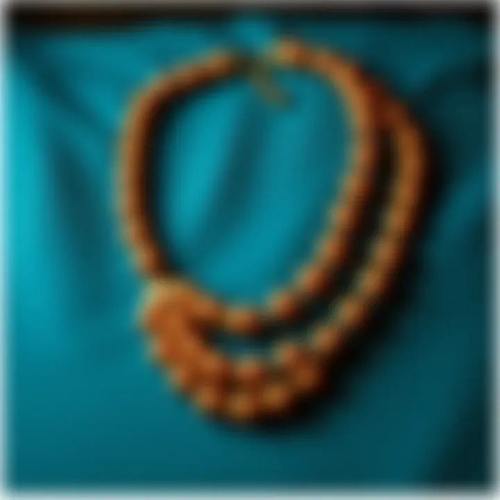 Elegant beaded chain necklace displayed on a velvet background