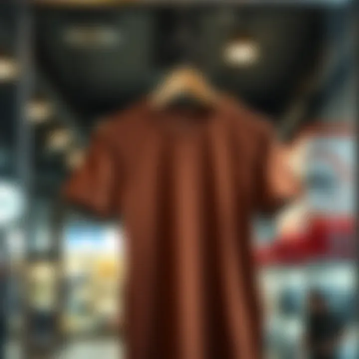 A stylish brown t-shirt on a wooden hanger