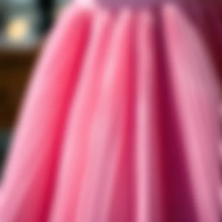 Close-up of the delicate pleats of a pink skirt reflecting elegance