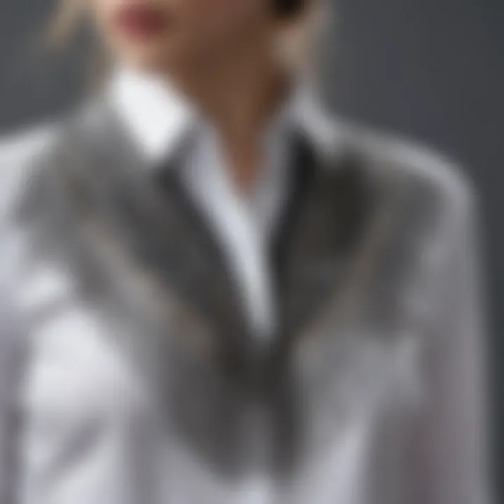 A detailed view of fringe embellishments on a contemporary shirt.